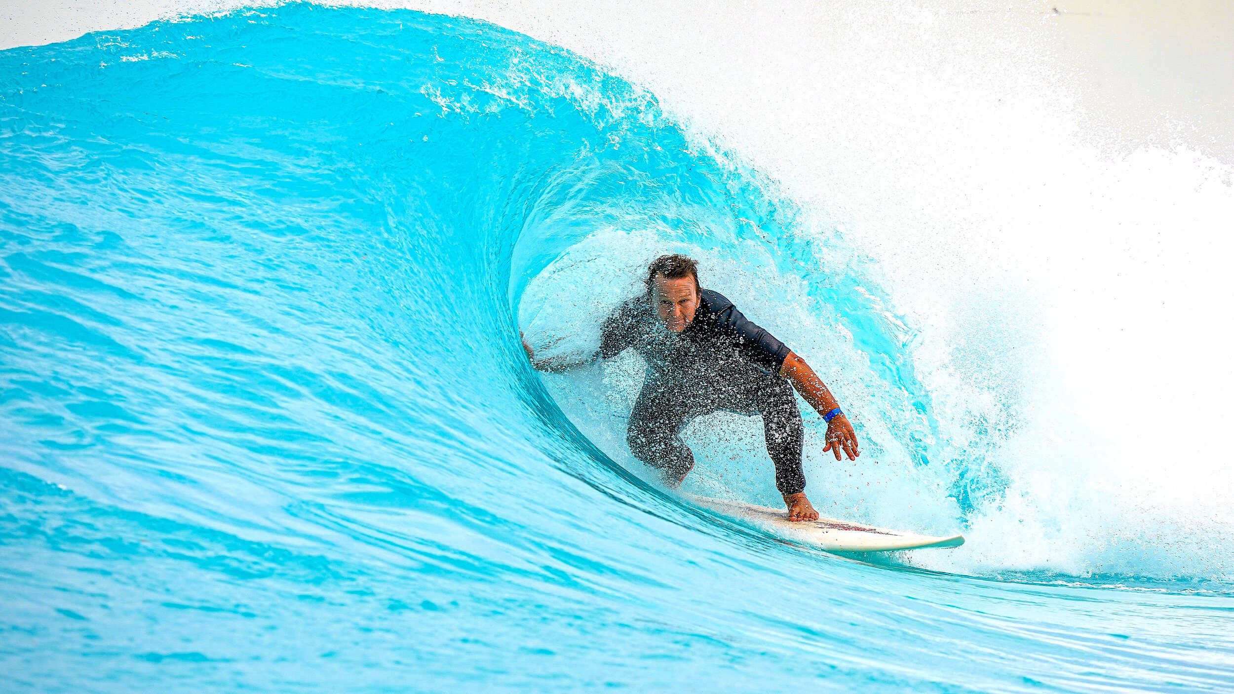 Muscle memory kicks in as the old fella squeezes into a tight little barrel at UrbnSurf
